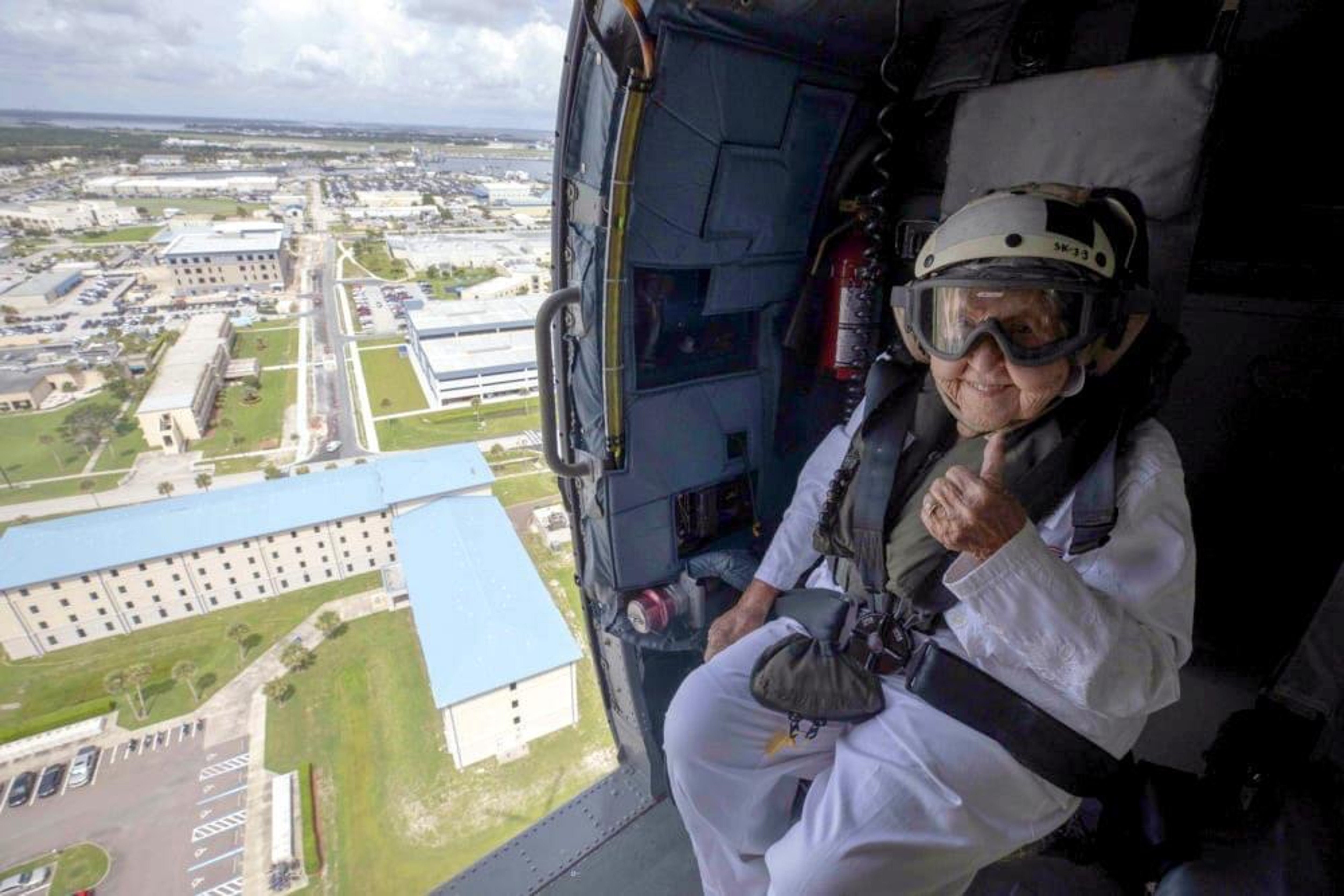 WWII Icon soars in Navy helicopter for her 100th birthday