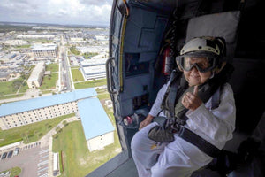 WWII Icon soars in Navy helicopter for her 100th birthday