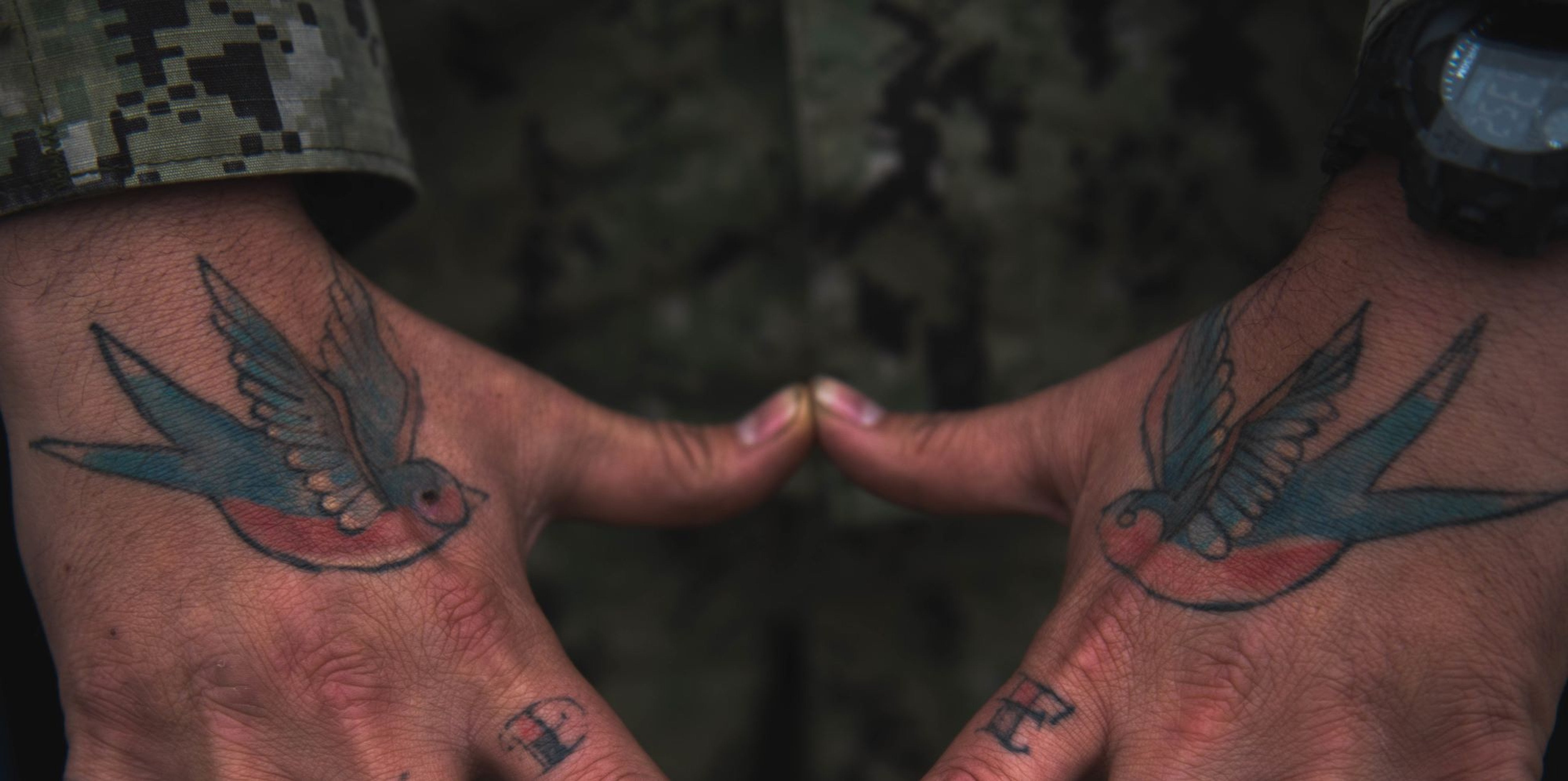 Japan may lift military tattoo ban