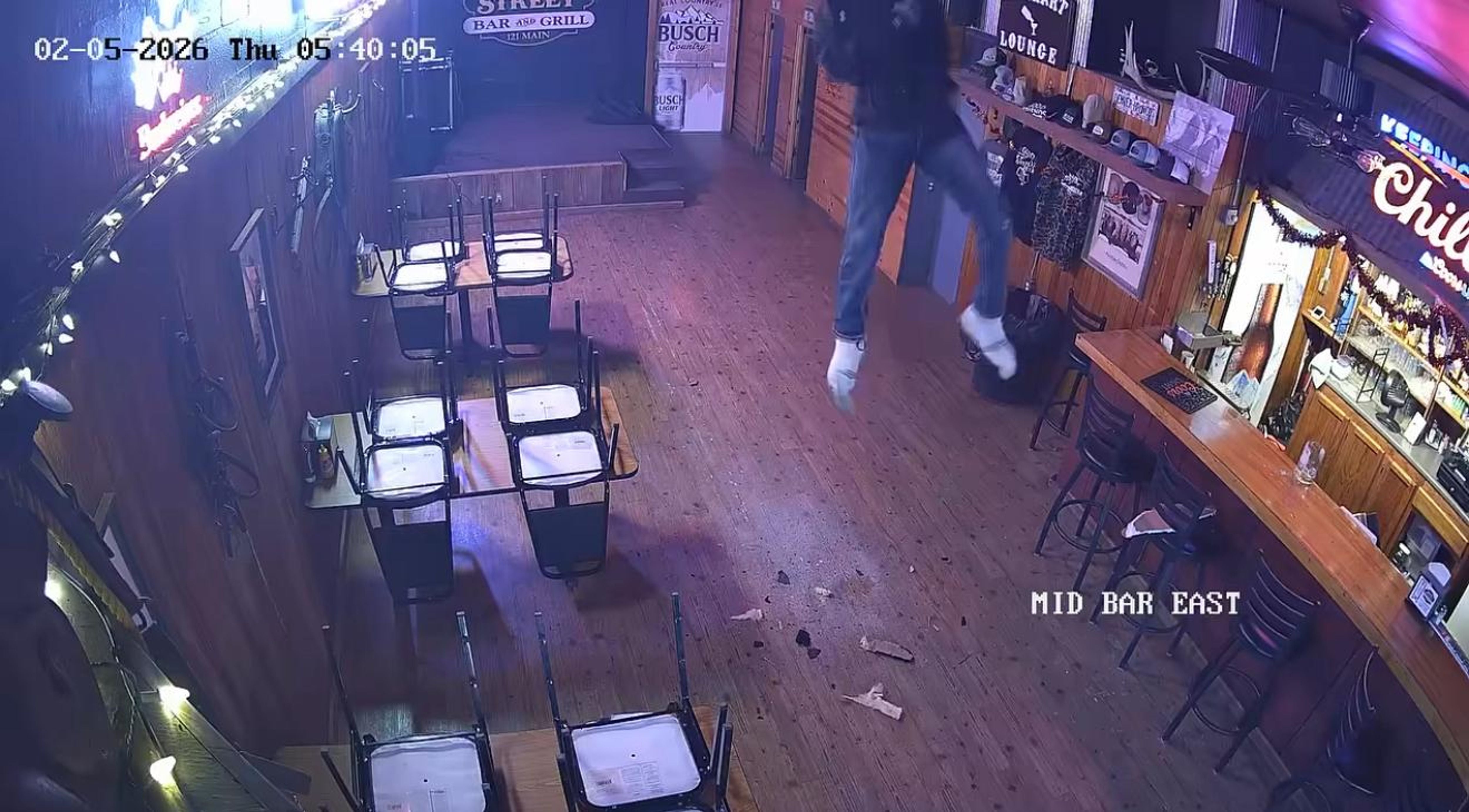 Suspect wanted after repelling into bar